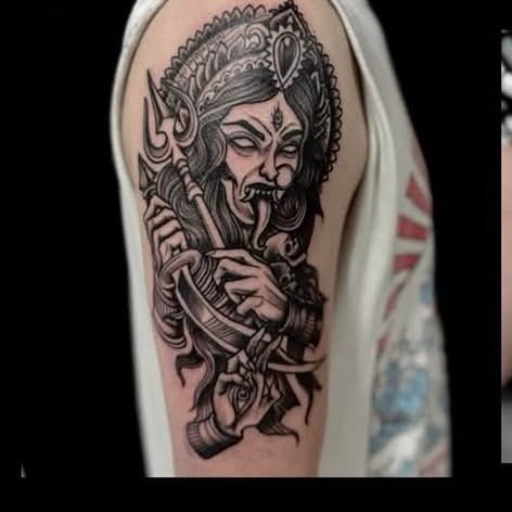 Blackwork Hindu deity shoulder tattoo by Clayton
