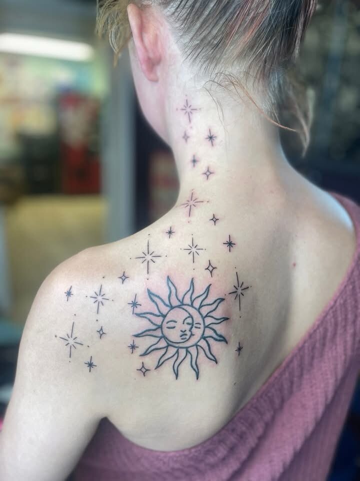Fine line celestial sun and stars back piece by Elleneese
