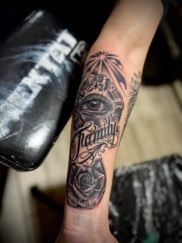 Black and grey clock and rose forearm tattoo by Sean