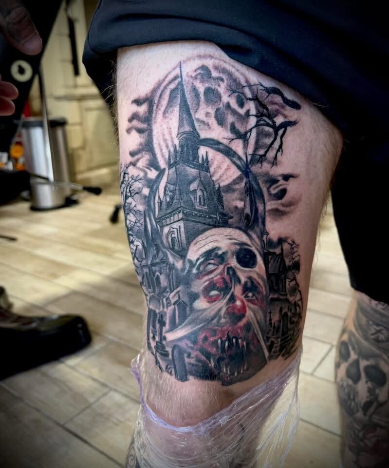 Gothic horror themed thigh tattoo by Sean